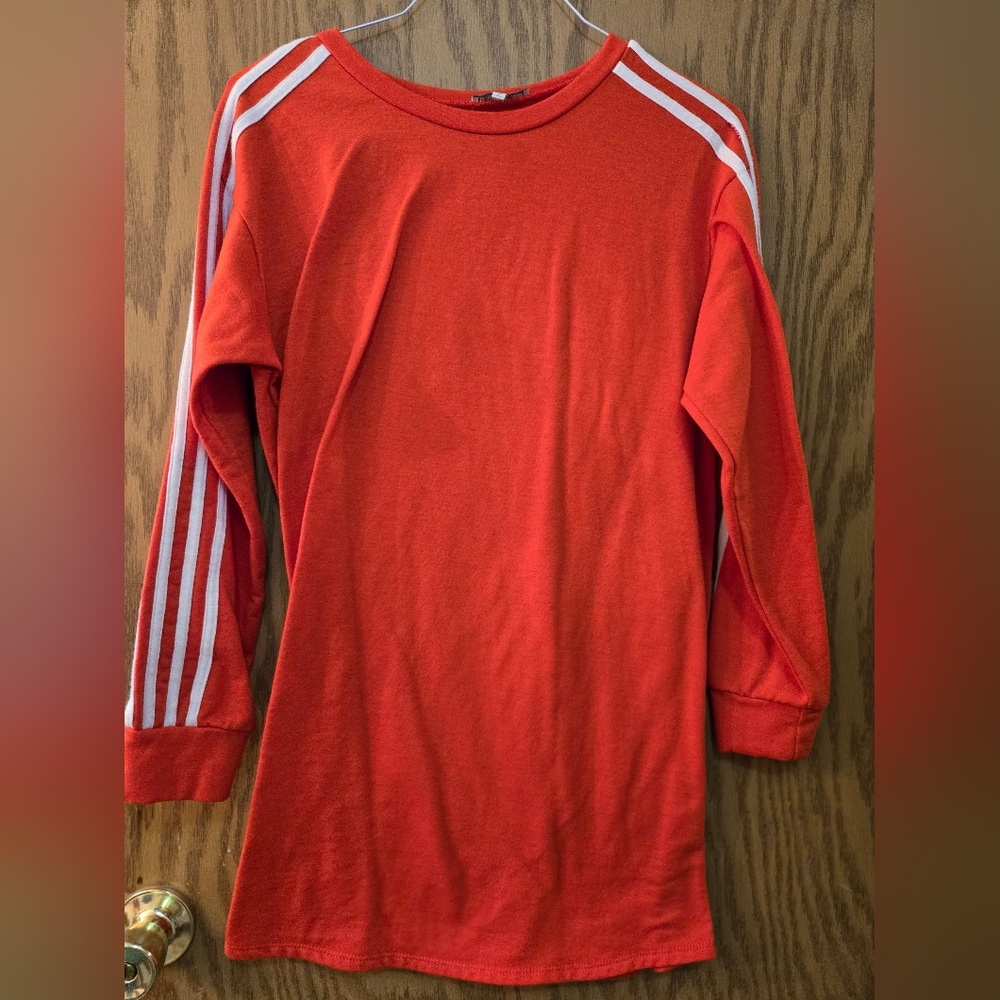 Very cute, long sleeve, orange sweat shirt with white stripes on the sleeves.